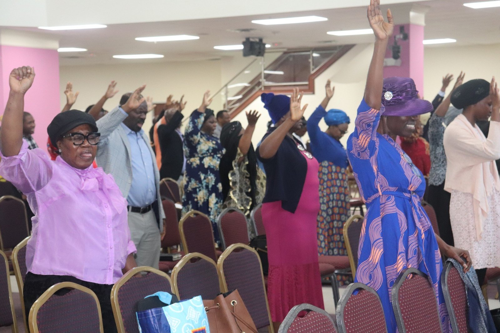 Worshippers with hands raised